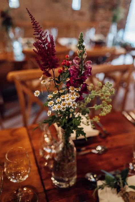 Flowers Bottles Centrepiece Decor Granary on the Common Wedding Bloom Weddings #wedding #weddingflowers Autumn Tablescapes Wedding, Bourbon Bottle Centerpiece Wedding Ideas, Fall Wedding Tablescapes Jewel Tones, November Wedding Flowers Centerpieces, Moody Wildflower Wedding, Bright Autumn Wedding, Fall Wedding Bud Vases, Dried Flower Centerpiece Wedding, Non Floral Wedding Centerpieces