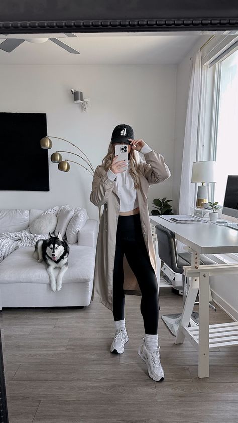 Athleisure Outfits Trench Coat, Athleisure With Trench Coat, Trench Coat Baseball Hat Outfit, Trench Coat Hoody Outfit, Sporty Trench Coat Outfit, Trench And Hoodie Outfit, Trench Coat With Sweatpants, Trench Coat Leggings Outfit, Trench Coat Airport Outfit