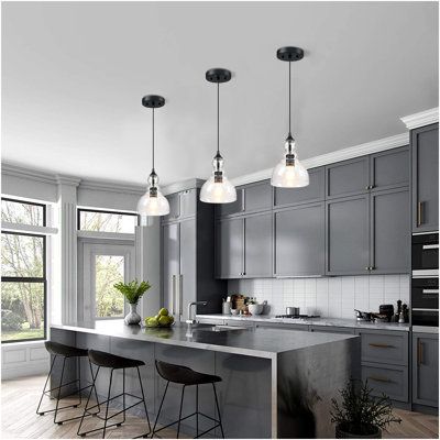 The 3-pack Kitchen Island Teardrop Glass Pendant light is a stylish and elegant pendant with an adjustable metal telescopic pole(0-60inch) and a bowl-shaped teardrop glass design that is exceptional artistic quality. Simple but yet elegant, with these 3 lights installed above the dining table, the round glass shade distributes light smoothly into the surrounding space creat a warm and pleasant atmosphere. It is easy to install, easy to clean, and suitable for kitchen, living room, dining room, b Teardrop Kitchen, Lights Over Island, Wide Pendant Light, Lights Over Kitchen Island, Seeded Glass Pendant, Clear Glass Pendant Light, Black Kitchen Island, Kitchen Island Pendant, Kitchen Island Lighting Pendant