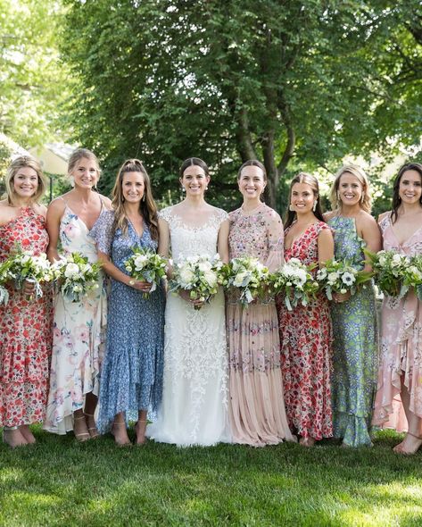 Floral print bridesmaid dresses are a modern wedding trend to watch. Whether mismatched in color, silhouette, pattern or material (or all of the above!), this is one way to achieve an eye-catching design moment in the wedding day fashion itself! Wedding Floral Dresses Bridesmaid, Flower Print Bridesmaid Dresses, Multi Pattern Bridesmaid Dresses, Floral Bridesmaid Dresses Fall, Missed Matched Bridesmaid Dresses, Flowered Bridesmaid Dresses, Bright Floral Bridesmaid Dresses, Mismatched Floral Bridesmaid Dresses, Mismatched Bridesmaid Dresses Summer Color Palettes