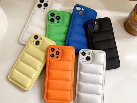 A phone case called a puffer case is made to give your phone more protection. Most cases have a padded design that protects your phone from damage when it falls or gets hit. Most puffer cases are silicone, TPU, or plastic, and they may have extra features like a built-in screen protector, a kickstand, or […] The post Puffer case appeared first on TechBullion. Puffer Phone Case, Puffer Case, Phone Stuff, Tshirt Design, Clear Cases, Iphone 12 Pro, Case Iphone, Iphone Phone Cases, Wallet Case