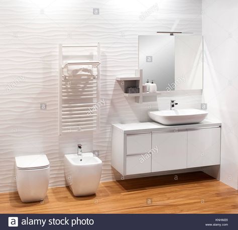 Download this stock image: Plain monochromatic white bathroom with simple vanity cabinet, bidet and toilet on a natural wood floor - KNHM20 from Alamy's library of millions of high resolution stock photos, illustrations and vectors. Small Bathroom Tile Ideas, Small Bathroom Tiles, 3d Wall Tiles, Natural Wood Flooring, Bathroom Shower Tile, Tile Ideas, Bathroom Tile, Traditional Bathroom, Ideas Bathroom