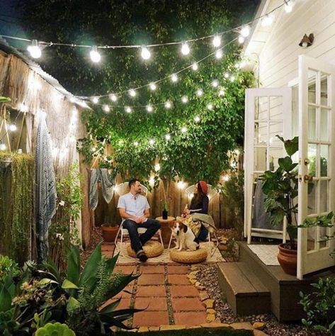 patio bistro lights #patiodecoratingideasonabudget Victorian Restoration, Small Outdoor Patios, Apartment Hacks, Patio String Lights, Small Patio Garden, Apartment Patio, Secret Gardens, Outdoor Lights, Small Space Gardening