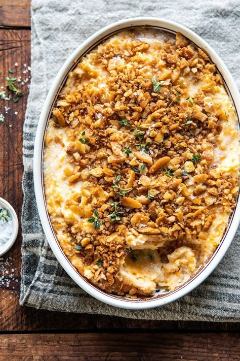 Cheesy Potato Casserole with Buttery Ritz Cracker--the only side dish recipe you really need. These potatoes are creamy, cheesy, and perfectly seasoned. The Ritz cracker topping is a touch buttery, perfectly garlicky, herby, and a little salty too.  Make these ahead of time for an easy holiday side that everyone will love.#cheesypotatoes #Christmasrecipes #potatocasserole Half Baked Harvest Recipes, Cracker Toppings, Cheesy Potato Casserole, Cheesy Potato, Harvest Recipes, Half Baked, Cheesy Potatoes, Half Baked Harvest, Ritz Crackers