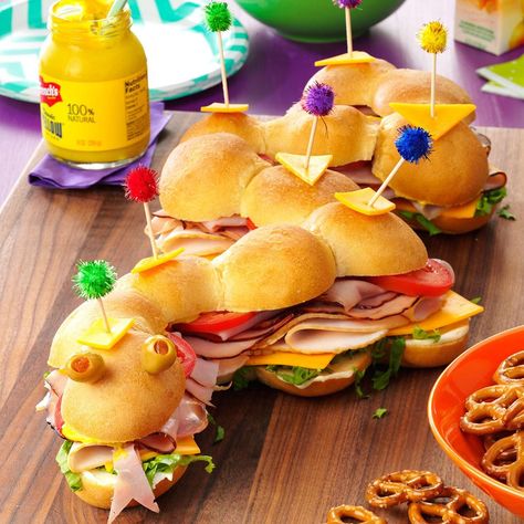 This slithering sub makes a fun and tasty centerpiece. Add your own zany, creative touches and feel free to mix and match the meat and cheeses to suit your family's tastes. You also can add breadsticks to make "legs" if you want the sub to look like a centipede. —Linda Overman, Wichita, Kansas Sandwich Ideas Party, Sub Sandwich Ideas Party, Sub Sandwich Ideas, Silly Snake, Princess Party Food, Sandwich Shapes, Party Breakfast, Snake Party, Meals Kids Love