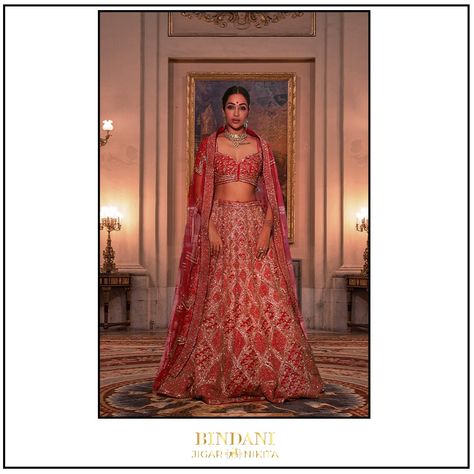 This captivating fire brick red lehenga is embellished with sequins, salli and crystals adorned in fish scale motifs giving a neo- classical essence to the traditional red colour. The "Koti" style blouse and a long veil style head dupatta with linear lines will make your grand entrance truly mesmerizing. #Bindani #BindanibyJN #RaniSa #couture #bridalwear #bridalcouture #CraftedbyBindani #bridalinspiration #bridalaffair #wedding #bridalstore #weddinglook #BridesofBindani Koti Style Blouse, Fire Brick, Veil Styles, Long Veil, Red Lehenga, Neo Classical, Designer Outfits, Bridal Stores, Fish Scale