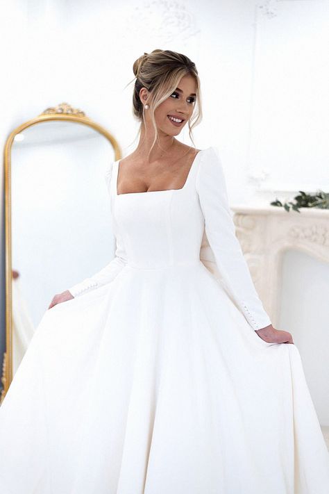 That bridal ball gown is perfect for your special moment. Speaking as a wedding planner, that enhances a grand ceremony. Keep this gown to your bridal board. Crepe Ballgown Wedding Dress, Long Sleeve Wedding Dress With Long Veil, Wedding Dress Square Neckline Sleeves, Long Sleeve Classic Wedding Dress, Long Sleeve Wedding Dress A Line, Long Sleeve Square Neck Wedding Dress, Square Neck Wedding Dress With Sleeves, Satin Wedding Dress With Sleeves, Long Sleeve Wedding Dress Ball Gown