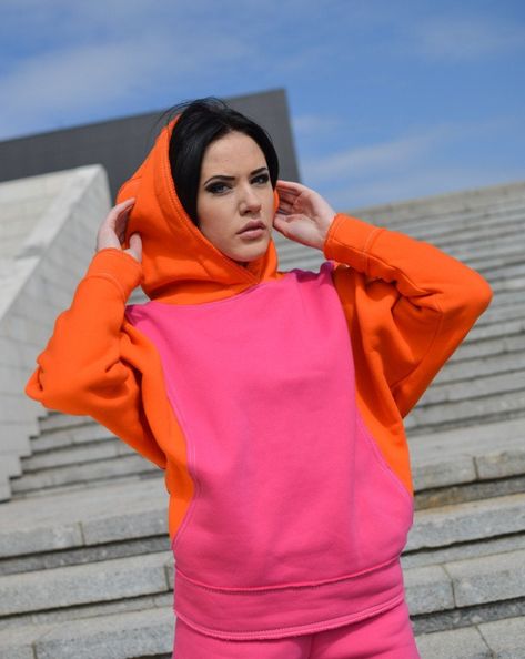 "Pink orange Hoodie for woman, baggy colored woman hoodie, short wide sleeves hoodie, cotton oversize hoodie, big hood sweatshirt hoodie. Designed for women! Soft&Cozy - that is all you need to feel good every day :) The large hood keeps your head warm. Two pockets in front. HQ-Heavy duty material. Density - 280g/m2. Made in EU. Size   Sleeve (in/cm)     Lenght (in/cm)         Bottom Width (in/cm)          Bust size    S        24/60                    23,6/60                     16,9/43               34,6-35,4/88-90    M        24,5/62                    23,6/60                     17,3/44               35,4-36,2/90-92     L        25/63                    24,8/63                     18,5/47               37,8-39,4 /96-100   Each piece is handmade, so there might be some slight changes. Woman Hoodie, Blue Sweatpants, Orange Hoodie, Dance Pants, Rose Orange, Black Sweatpants, Blue Hoodie, Gorgeous Fabrics, Pink Hoodie