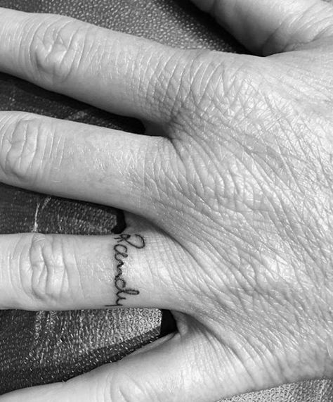 Top 57 Name Tattoo Ideas [2020 Inspiration Guide] Name Tattoo In Finger, Ring Finger Tattoo Couple Name, Rachel Tattoo The Name, Ring Name Tattoo, Name Tattoos On Finger, Name On Ring Finger Tattoo, Finger Name Tattoo, Boyfriends Name Tattoo Ideas, Boyfriend Name Tattoos