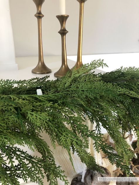 How to attach garland to a fireplace mantel (Sunny Side Up) Cypress Garland Mantle, Greenery On Mantle, Christmas Mantles Ideas Fireplaces, Garland Fireplace Mantle, Mantle Greenery, Fireplace Christmas Decorations, Garland On Mantle, How To Hang Garland On Mantel, Christmas Sheets