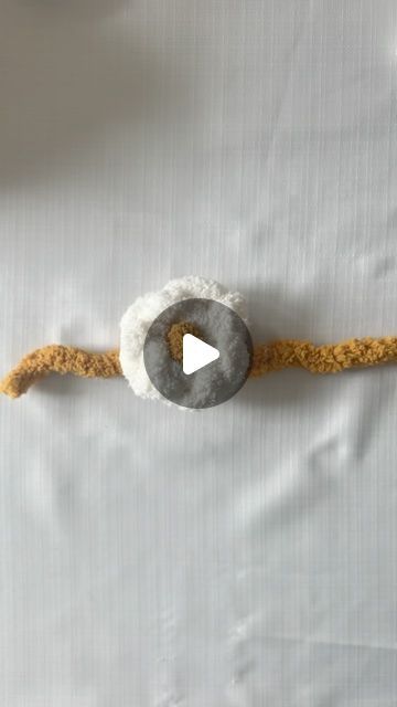 Cozy Cloud Knits ✿ Nicole Panchley on Instagram: "How to create a flower to add to your blankets and pillows:

🌸Petals: 
-Create a slip knot and chain with 6 total loops
-Overlap your first and last loop and pull your working yarn through both and pull tight to create a circle. 
-Tie a knot with your tail yarn and working yarn to secure the circle in place. 
-Trim the ends

🟡Center:
-Take a piece of yarn approx 8-12’’ long and tie a double knot directly in the center. 
-Feed one end of yarn through the center of one of your chains (petals). 
-feed the other end of yarn through the center of one of your chains (petals) directly across from the first. 
-Flip your flower over and tie a knot. 

🧶To Connect: 
-Blanket: Use the tails to connect to a blanket by feeding it through a stitch in y How To Tie Off Crochet End, Blankets And Pillows, Tie A Knot, Slip Knot, Double Knot, The Circle, A Circle, A Blanket, A Flower