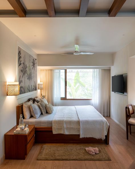 The fusion of design philosophies within this home not only pays homage to the past but also propels the home into a realm of new-age luxury.🤍 In the Master bedroom of the Maison Blanché project, faux wood beams divide the space. On the left, the bed a family heirloom, takes centre stage. Set against a tropical mural, the bed faces a fluted wall. The bedroom is a curated collection of textures and layers. A narrative of refined elegance and tactile warmth runs through the space. The double-... Double Bed Against Wall, Wall Mounted Double Bed, Double Bed Beige, Double Rattan Bed, Rattan Double Bed, Tropical Mural, Waterfall Counter, Fluted Wall, Bespoke Chair