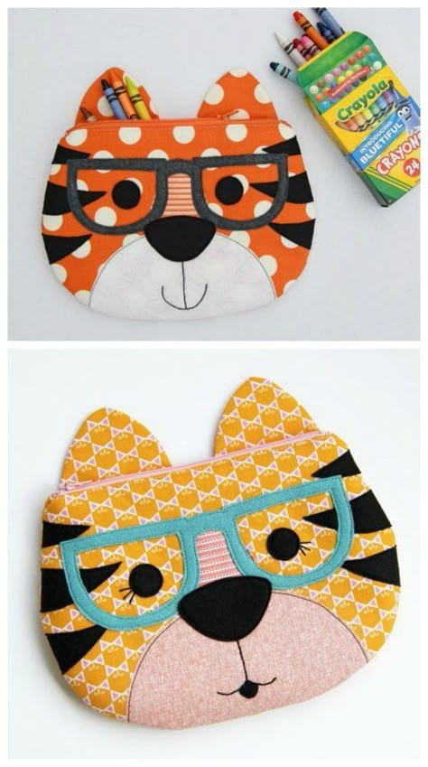 Tiger zipper pouch sewing pattern. Sew a tiger with or without glasses, or leavev off the stripes, sew on whiskers and make him a cat zipper pouch. Pencil case sewing pattern for kids. Cat zipper pouch, animal zipper pouch sewing pattern. #ZipperPouchPattern #PouchPattern #SewABag #EasySewingPattern #QuickSewingPattern #BagSewingPattern #KidsSewingPattern #ZipperBagPattern Cat Zipper Pouch Tutorial, Cat Zipper Pouch Pattern, Animal Pencil Case, Zipper Pouch Pattern, Animal Zipper Pouch, Cheap Cat Design Pouch Bag, Cat Pouch, Pouch Sewing Pattern, Pencil Case Sewing