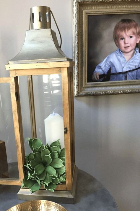 Decorative lantern with succulents and a candle for spring. Decorate With Lanterns Indoors, Summer Lantern Filler Ideas, Modern Lantern Decor, Spring Lantern Ideas, Decorating With Lanterns Indoors, Indoor Lantern Decor Ideas, Decorative Lanterns Indoor, Outdoor Lantern Ideas, Lantern Filler Ideas