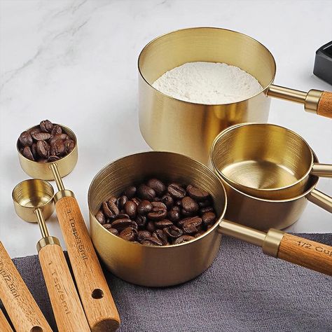 Aesthetic gold measuring cups and spoons with a wooden handle. Modern Utensils, Flour Scoop, Stainless Steel Measuring Cups, Measuring Cups And Spoons, Measuring Cups & Spoons, Baking Utensils, Measuring Cups Set, Liquid Measuring Cup, Metal Kitchen