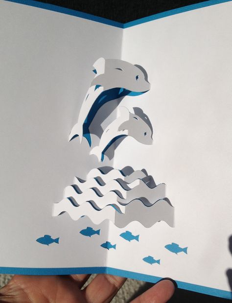 Dolphins in the waves pop-up card Pop Up Template, 3d Tipografi, Arte Pop Up, Diy Pop Up Cards, Pop Up Card Templates, Origami And Kirigami, Pop Up Art, Paper Pop, Art Origami