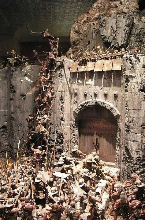 This is an incredible diorama of the Battle of Helms Deep from the Lord of the Rings. A Daily Dose for 01july2014 from the Michigan Toy Soldier & Figure Co. www.michtoy.com Battle Of Helms Deep, Helms Deep, Battle Scene, Game Terrain, Model Maker, Wargaming Terrain, Military Modelling, Military Diorama, The Lord Of The Rings