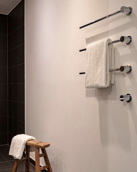 Create lovely linear lines using the stylish and modern, VOLA T39 heated towel warmer   #vola #bathroomdesign #bathroomideas #bathrooms #towelwarmer #bespokebathrooms #towelrail #heatedtowelwarmer #heatedtowelrail #commercialbathrooms #architecturalstyle Heated Towel Bars Bathroom, Towel Warmer Bathroom Wall Mount, Scandinavian Hotel, Black Towel Warmer, Heated Towel Bar, Bathroom Architecture, Hotel Bathroom Design, Luxury Hotel Bathroom, Heated Towel Racks Bathroom