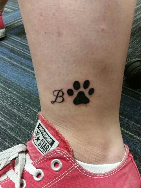 Initial and paw print. Paw With Letter Tattoo, Dog Paw Tattoo With Letter, Paw Print Tattoo With Initial, Dogs Paw Tattoo, Body Writing, Cat And Dog Tattoo, Dogs Tattoo, Dogs Paw, Cat Tattoo Simple