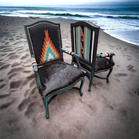 Black cowhide, Mexican diamond fabric painted wooden chairs silver tone nailhead trim. Western Upholstery Fabric, Santa Fe Interior Design, Western Chairs, Santa Fe Interiors, Painted Wooden Chairs, Western Chair, Furniture Remodel, Diy Furniture Upholstery, Ranch Furniture