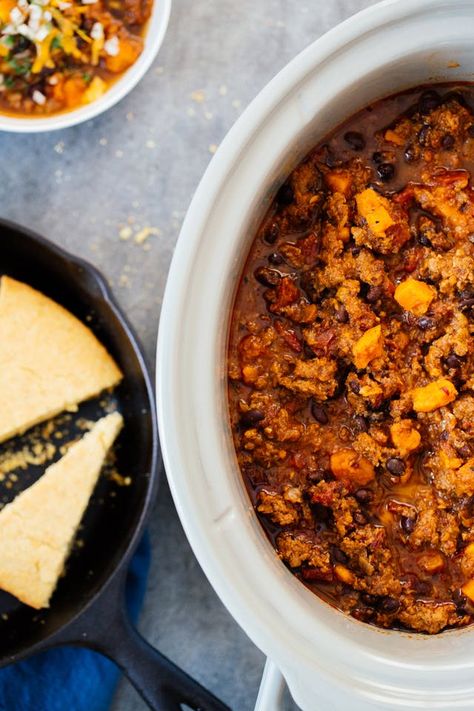 When people get a slow cooker, chili is often the first thing they make with it. And why not? With minimal effort and several hours of hands-off cooking, you're gifted with a robust meal that feeds a crowd. This version is especially winning with its delicious, healthful mix of ground turkey, sweet potatoes, black beans, tomatoes, and chipotles. Chili With Sweet Potato, Turkey Sweet Potato Chili, Sweet Potato Chili Recipe, Turkey Sweet Potato, Slow Cooker Turkey Chili, Potato Chili, Slow Cooker Turkey, Crockpot Chili, Sweet Potato Chili