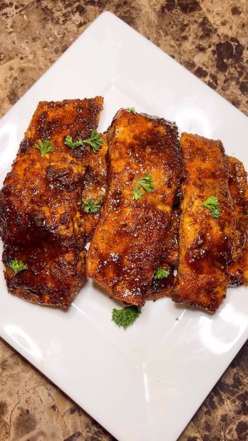 The REAL Way Joint on Instagram: "Honey Jerk Salmon in a REAL Way 🤤🔥 • Honey Jerk Salmon Recipe ⁃ 1.5-2 lbs of Salmon cut into filets ⁃ 2 tbs Jerk Paste ⁃ 1 tbs Jerk BBQ Sauce ⁃ 1 tsp Brown Sugar ⁃ 2 tbs Honey ⁃ 2 tsp Olive Oil ⁃ 1 tsp Garlic Powder ⁃ 1 tsp Onion Powder ⁃ 1 tsp Smoked Paprika ⁃ 1 tsp Black Pepper ⁃ 2 tsp Jerk Seasoning ⁃ Pinch of Salt Mix all dry seasonings together. Rub seasonings onto salmon. Make sure to get all sides. Once seasoned, add a little olive oil on sa Honey Jerk Salmon, Jerk Salmon Recipe, Jerk Bbq Sauce, Jerk Paste, Jerk Salmon, Cajun Salmon, Jerk Seasoning, Salmon Recipe, Dry Rub