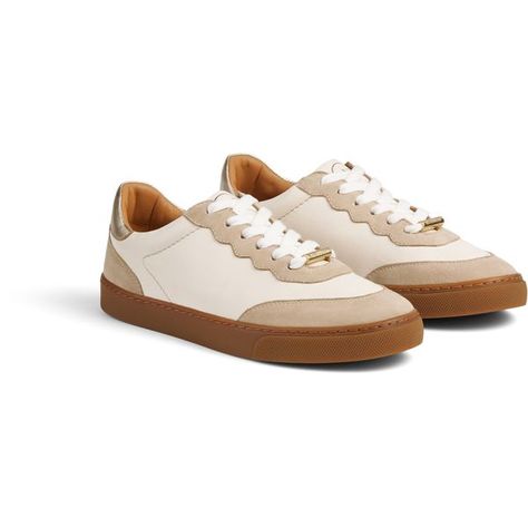 The LKB Runner trainers are crafted from white nappa leather and beige suede.
They have pretty scallop detail, laces tipped in gold metal with a matching
gold bar to the front, a gold leather back counter with the LKB logo and gold
disc detail, and a tan rubber sole.