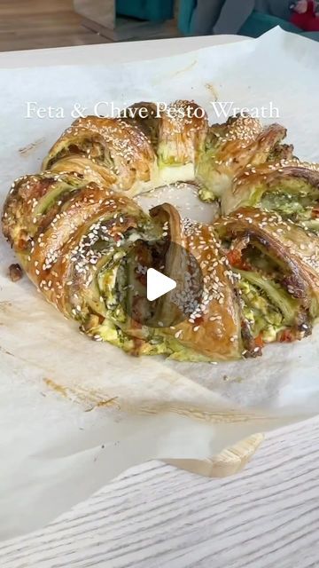 Foodsteer on Instagram: "Feta and Chive Pesto Wreath 👌

Ingredients:

1 x sheet puff pastry 
1/4 x cup pesto (I used Chive) 
200g / 7oz feta crumbled 
2 x tomatoes & 1 garlic clove chopped and drained 
1 x egg for brushing
Sesame seeds 
Drizzle of honey (optional) 

Preheat oven to 190C / 374F

- start by chopping your tomatoes and garlic and season with salt and pepper, drain the juice after 5 min 

- roll out your puff pastry on a sheet of greaseproof paper and spread your pesto, feta and tomatoes and roll vertically

- make diagonal cuts in the roll ONLY about 2/3 down then squish down the parts in the middle with a stick type object as shown in the reel. I used a straw but chopstick would work. Shape into a circle and pinch the two ends to join them together.

- brush with egg wash ad Pesto Wreath, Pastries Savory, Chive Pesto, Phyllo Dough Recipes, Garlic Clove, Pesto Recipe, Xmas Food, Finger Food Appetizers, Healthy Kitchen