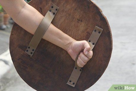 How to Make a Wooden Shield: 15 Steps (with Pictures) - wikiHow Larp Diy, Greek Shield, Escudo Viking, Round Shield, Wooden Shield, Viking Shield, Shield Maiden, Shield Design, Wood Toys