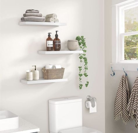 Floating shelves perfect for a cozy book corner without creating the clutter that a traditional bookcase does. Hanging Shelves Bedroom, Black Hanging Shelves, Shelves Bedroom, Easy Shelves, Black Floating Shelves, Black Shelves, White Shelves, Mounted Shelves, Floating Wall Shelves