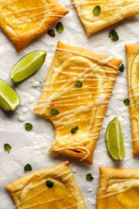 This Pineapple Danish Recipe features Homemade Pineapple Sauce, cream cheese, and a zesty lime icing! These pineapple danishes are so easy to make but so good, they're the perfect summer treat or breakfast idea! Pineapple Danish, Colombian Hot Dog, Lime Icing, Danish Recipe, Pineapple Sauce, Pineapple Jam, Danish Food, Frozen Puff Pastry, Breakfast Idea