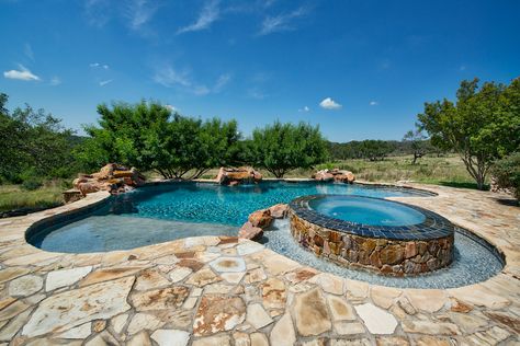 Take in those breathtaking Hill Country views from this custom home's stunning pool! Ranch House Pool Ideas, Hilly Backyard With Pool, Cowboy Pool With Deck, Texas Hill Country Pools, Infinity Pool Backyard, Country Pool, Currumbin Rock Pools, Underground Pool, Country Home Exterior