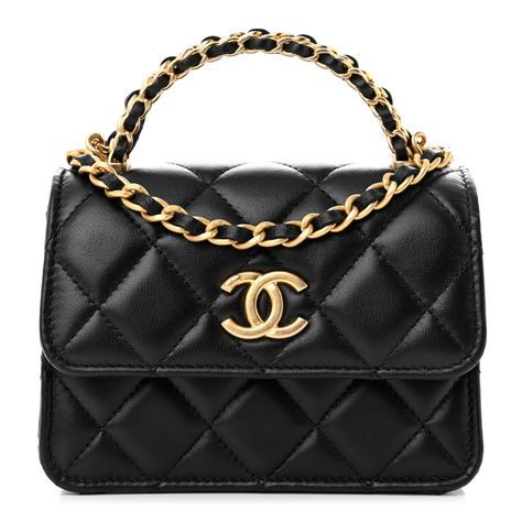 This is an authentic CHANEL Lambskin Quilted Chain Top Handle Clutch With Chain in Black. This crossbody bag is crafted of diamond-quilted lambskin leather in black. The bag features a sturdy polished light gold chain handle, an optional gold chain shoulder strap, and a matching magnetic CC logo on the crossover flap. This opens the bag to a partitioned black fabric interior with card slots. Designer Black Bag With Chain, Luxury Black Bag With Chain Strap, Luxury Black Box Bag With Chain Strap, Luxury Black Clutch With Chain Strap, Black Luxury Flap Bag With Gold-tone Hardware, Chain Top, Top Handle, Lambskin Leather, Black Fabric