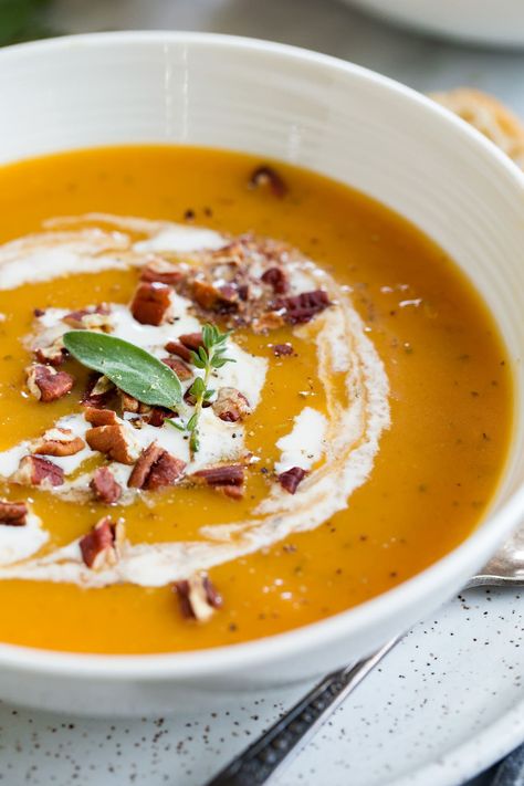 The BEST Butternut Squash Soup - made with roasted squash halves so it's easy and so flavorful! It's an absolutely perfect fall soup! I loved the addition of rich cream and crunch toasted pecans. #butternutsquash #soup #fall #thanksgiving #recipe #cookingclassy Half Baked Harvest Butternut Squash, Butternut Squash Soup Crockpot, Best Butternut Squash Soup, Vegan Butternut Squash Soup, Easy Butternut Squash, Butternut Squash Soup Recipe, Butternut Squash Recipes Soup, Squash Soup Recipe, Roasted Butternut Squash Soup