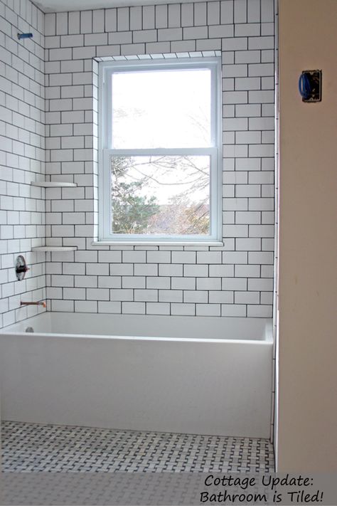 Subway tile tub surround Basketweave Tile Bathroom, Update Bathroom, Dark Grout, White Subway Tile Bathroom, Tile Tub Surround, Bathroom Tile Inspiration, Subway Tile Showers, Modern Tub, Subway Tiles Bathroom