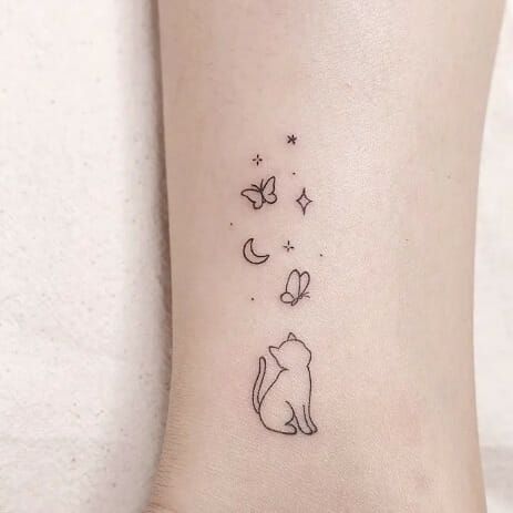 A minimalist cat tattoo can be a charming and subtle way to express your love for felines. Consider a simple outline of a cat's silhouette, perhaps with clean lines and minimal detail. You could opt for a small design on your wrist, ankle, or behind the ear for a discreet yet stylish look. Black ink tends to work well for minimalist tattoos, but you could also explore other subtle colors if you prefer. Just ensure you find a talented tattoo artist who specializes in minimalist designs Tiny Cat Tattoos For Women, Cat With Butterfly Tattoo, Simple First Tattoos For Women, Cute Cat Tattoo Simple, Cat Butterfly Tattoo, Butterfly Simple Tattoo, Cat And Butterfly Tattoo, Tattoo For Cat, Small Cute Tattoos For Women