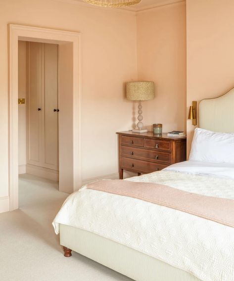 Another earthy pink favored by designers and homeowners the world over. Setting Plaster is an iconic Farrow & Ball shade, again not quite pink not quite beige, it's some dreamy color in between. It's the perfect alternative to a safer neutral like a white or cream. Image credit: Berkeley Place Fowler Pink Farrow And Ball, Farrows Cream Farrow And Ball, Earthy Pink And Green Color Palette, Cream Bedding Aesthetic, Setting Plaster Farrow And Ball Bedrooms, Pink And Neutral Bedroom, Setting Plaster Bedroom, Farrow And Ball Cream, Pink Ground Farrow And Ball