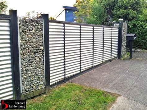 fence made of corrugated iron and gabione - photographed by ... Coragated Metal, Corrugated Metal Fence, Metal Fence Panels, Home Engineering, Privacy Fence Designs, Gabion Wall, Corrugated Board, Diy Fence, Privacy Fences