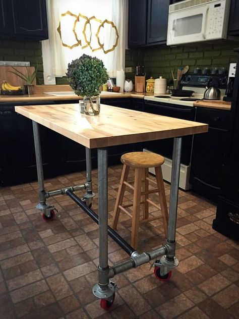 a portable industrial kitchen island of metal pipes on casters and a butcher block as a top can be DIYed by you Tube Furniture, Kitchen Islands Ideas With Seating, Portable Kitchen Island, Kitchen Island Storage, Butcher Block Island Kitchen, Industrial Kitchen Island, Property Ideas, Kitchen Island On Wheels, Kitchen Island Bench