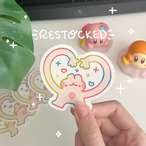 may mini sh0p update! ✨ i didn’t expect the rainbow heart bunny to be so popular last time so i’ve restocked it now! also have some new funny bunny stickers as well as a few fun clear stickers (tamagotchi + little treats) plus some other new designs. available now! 💗 link in bio or krisswanart.etsy.com #shopupdate #stickershop #etsyshop #vinylstickers #bunnystickers #bunnyart #bunnyartist #cutearteveryday #clearstickers #waterbottlestickers #memestickers Cute Branding Design, Kawaii Stickers Png, Studio Ghibli Stickers, Cute Sticker Design, Sticker Design Ideas, Sticker Drawing, Bunny Stickers, Sticker Design Inspiration, Mini Stickers