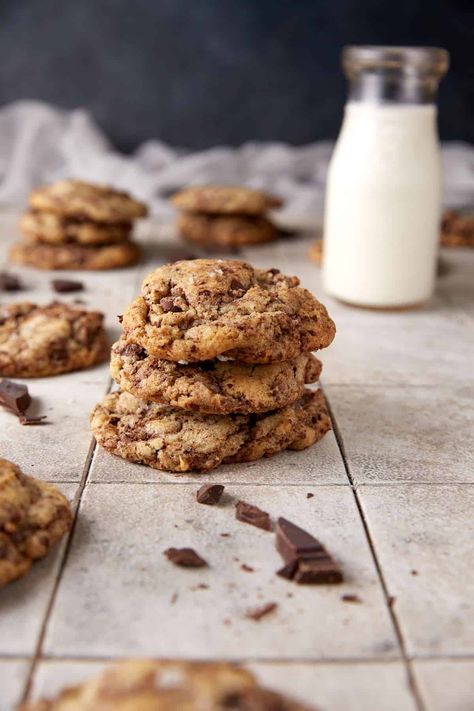 A stack of cookies next to a bottle of milk. Cookie Stack, Bottle Of Milk, Triple Chocolate Chip Cookies, Triple Chocolate Cookies, Types Of Chocolate, Flaky Salt, Chocolate Butter, Triple Chocolate, Cookie Sheet