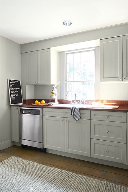 Best Greige Paint Colors - Benjamin Moore's Titanium OC-49. Via @benjamin_moore Two Tone Kitchen Cabinets Color Combinations, Kitchen Benjamin Moore, Soffit Lighting, Best Greige Paint Color, Blue Rocking Chair, Benjamin Moore Kitchen, Grey Painted Kitchen, Sink Dishwasher, Kitchen Soffit