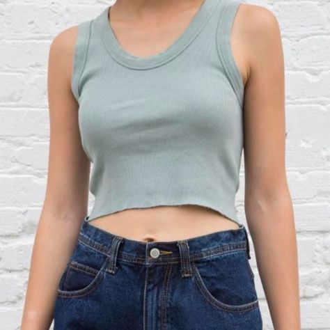 Brandy Melville, Soft Ribbed Cropped Cotton Tank With Matching Trimmings And A Raw Edge Hem. It Is 100% Cotton And The Measurements Are 17" (43 Cm) Length, 13" (33 Cm) Bust. It Is Not Brand New And Has Been Worn But It Is In Good Condition. There Are No Rips Or Pilling But There Is A Very Slight, Minor Discoloration Spot On The Front As Seen In The Picture. Sage Green Tank Top, Brandy Melville Style, Light Blue Crop Top, Classic Wardrobe Staples, Green Tank Top, Blue Crop Tops, Green Brands, Green Tank, John Galt