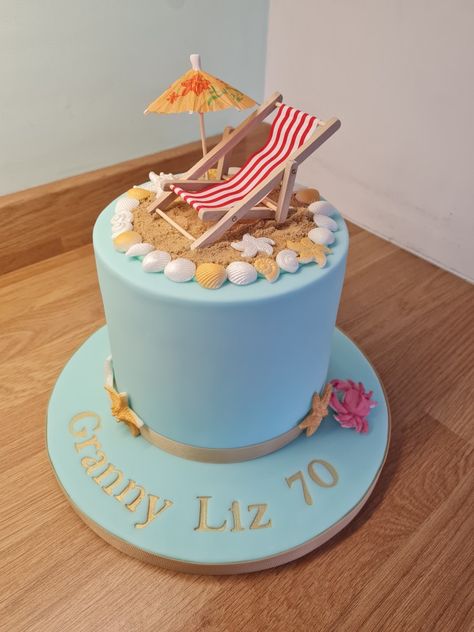 Beach themed 70th Birthday cake with miniature deckchair, bought on Amazon. @minibakescupcakes on Instagram @minibakescupcakesbysarah on Facebook 70th Beach Birthday Party, 70th Birthday Beach Theme, Seaside Birthday Cake, Retirement Party Cakes, Beach Themed Cakes, Beach Cake, 70th Birthday Cake, Dad Birthday Cakes, Holiday Cake