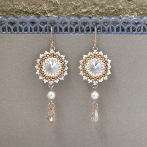 "I created this champagne drop earrings by hand, using Swarovski Rivoli 12mm, Swarovski pearls 5mm, Miyuki round seed beads, Miyuki Delica beads, and 14k goldfilled ear-wire * Measurements: Earring length: 2.36\" (6cm) Pendant diameter: 0.78\" (2cm) * The earrings will come beautifully packaged for a gift. * For other Bridal earrings: https://www.etsy.com/ca/shop/LioraBJewelry?ref=listing-shop2-all-items-count%C2%A7ion_id&section_id=16552834 * my shop: https://www.etsy.com/shop/LioraBJewelry Crystal Drop Earrings Wedding, Dangle Pearl Earrings, Pearl Bridal Earrings, Champagne Earrings, Swarovski Crystal Drop Earrings, Crystal Earrings Wedding, Crystal Bridal Earrings, Bridal Earrings Drop, Pearl Earrings Wedding