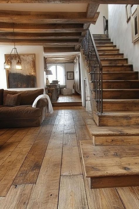 Transform your home with the timeless beauty of wooden flooring. From rich hardwoods to distressed finishes, wooden floors add elegance and durability to any room. 🛠✨🌲 #WoodenFlooring #HomeDecor #TimelessDesign #ElegantLiving Wide Board Wood Flooring, Rustic Wide Plank Wood Floors, Wood Floor House Interior Design, Stone And Wood Flooring, Mountain Home Flooring, Real Wood Floors Hardwood, Flooring Farmhouse Style, Burnt Wood Flooring, Medium Stain Wood Floors