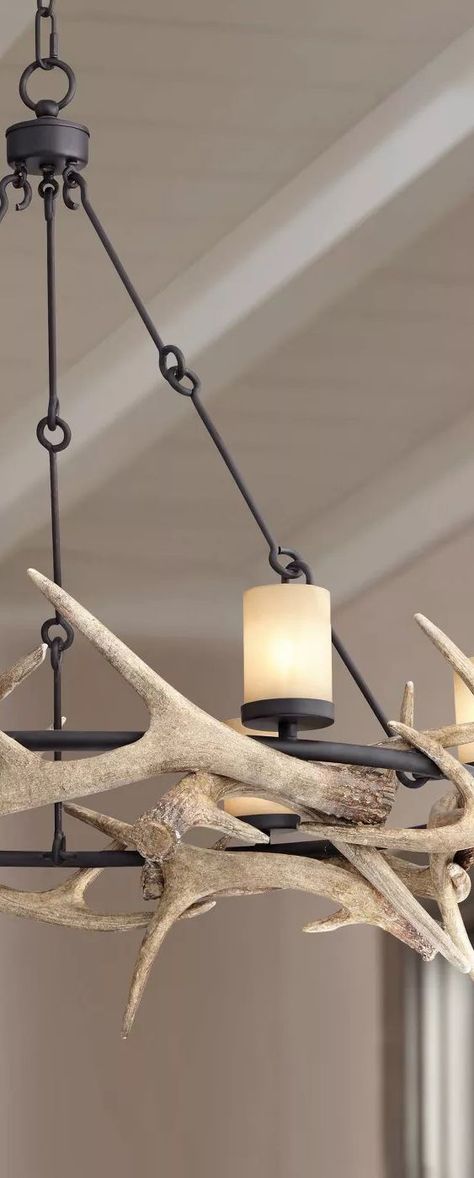 Enhance a farmhouse or lodge-cabin setting with this stylized rustic antler chandelier. This handsome design comes in a round black finish frame, with faux deer horn accents woven around like a jagged crown. #rusticlighting #rusticchandeliers #farmhouselighting #farmhousechandeliers #antlerlighting #antlerchandelier #decoratingideas #rustic #farmhouse #chandeliers #loghomes #logcabins Rustic Ranch Decor, Mountain House Decor, Antler Lights, Antlers Decor, Farmhouse Chandeliers, Antler Chandelier, Loft Lighting, Large Chandelier, Deer Horn