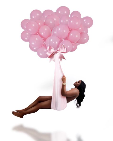 Pregnant mom floating with balloons and a fabric holding her with the reflection of herself on the bottom Maternity Photography Hanging, Hanging Maternity Shoot, Floating Maternity Photoshoot, Balloon Maternity Photoshoot, Floating Maternity Shoot, Pink Maternity Photoshoot, Maternity Photography Outfits, Maternity Picture Outfits, Maternity Studio Photoshoot