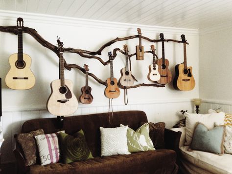 We planted ourselves a little guitar tree and this is our first years harvest! Hoping for larger crop next year, maybe the uke buds will grow into an Olson, Ryan, Santa Cruz , but even a Taylor would be nice! My husband is an amazing artist! I asked for a creative guitar hanger and this is what he came up with. Guitar Storage, Home Music Rooms, Guitar Display, Guitar Room, Guitar Stands, Budget Design, Guitar Hanger, Deco Studio, Guitar Wall