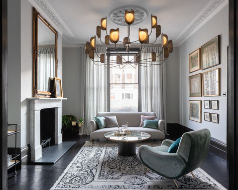 As part of a full refurbishment of a Victorian family home in London. MH Costa restored key original features of the lounge in this property including ceiling cornicing and ceiling rose. Paired together with high-end mid-century inspired furnishings make this room a warm and inviting room within a family home. 

#lounge #sofa #light #lighting #fireplace #cornicing #cornice #victoria #refurbishment #homerenovation Victorian Through Lounge Ideas, Victorian Living Room Lighting Ceiling, Victorian Living Room Ceiling Light, Victorian Reception Room, Victorian Through Lounge, Through Lounge Ideas Victorian Houses, Victorian Terrace Middle Room, Victorian Knock Through Lounge, London Victorian Terrace Bedroom